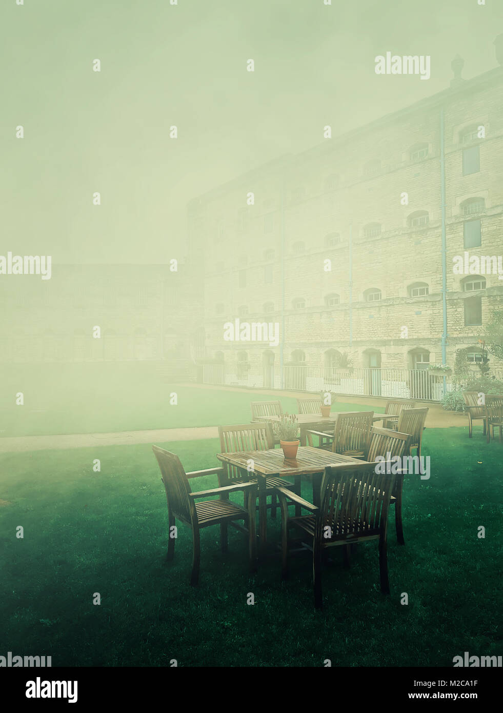 Oxford catle garden in a foggy english morning. Prison in the past and hotel in present. Stock Photo