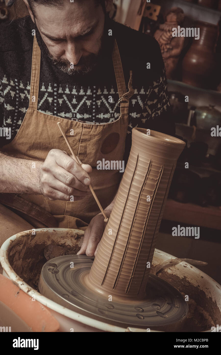 elderly man making pot using pottery wheel in studio Stock Photo Alamy
