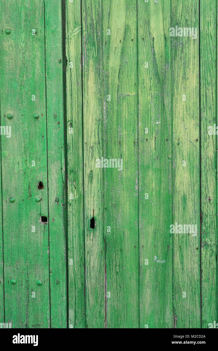Weathered wooden door painted in green, a background Stock Photo - Alamy