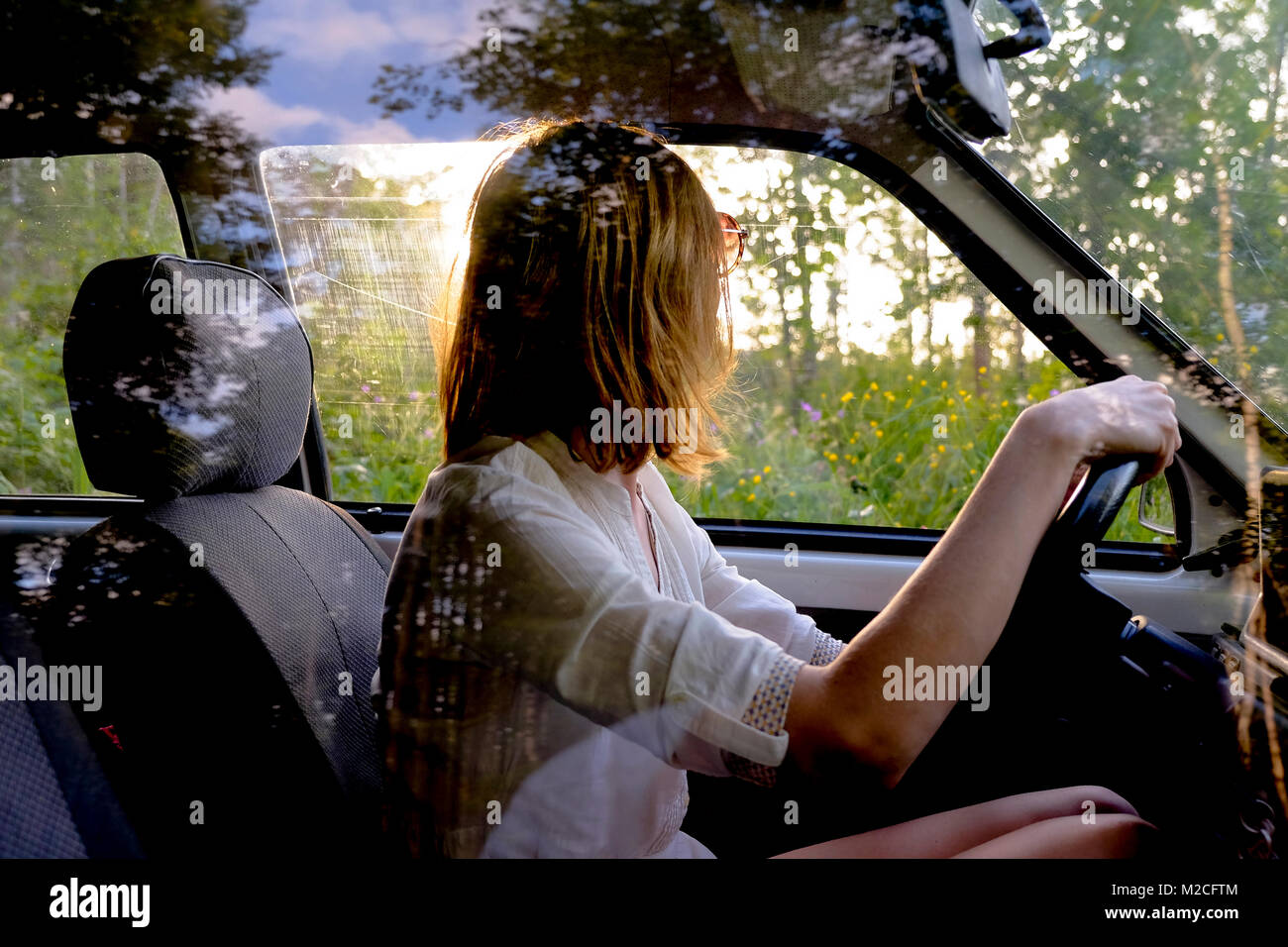 Woman getting car holding hi-res stock photography and images - Alamy