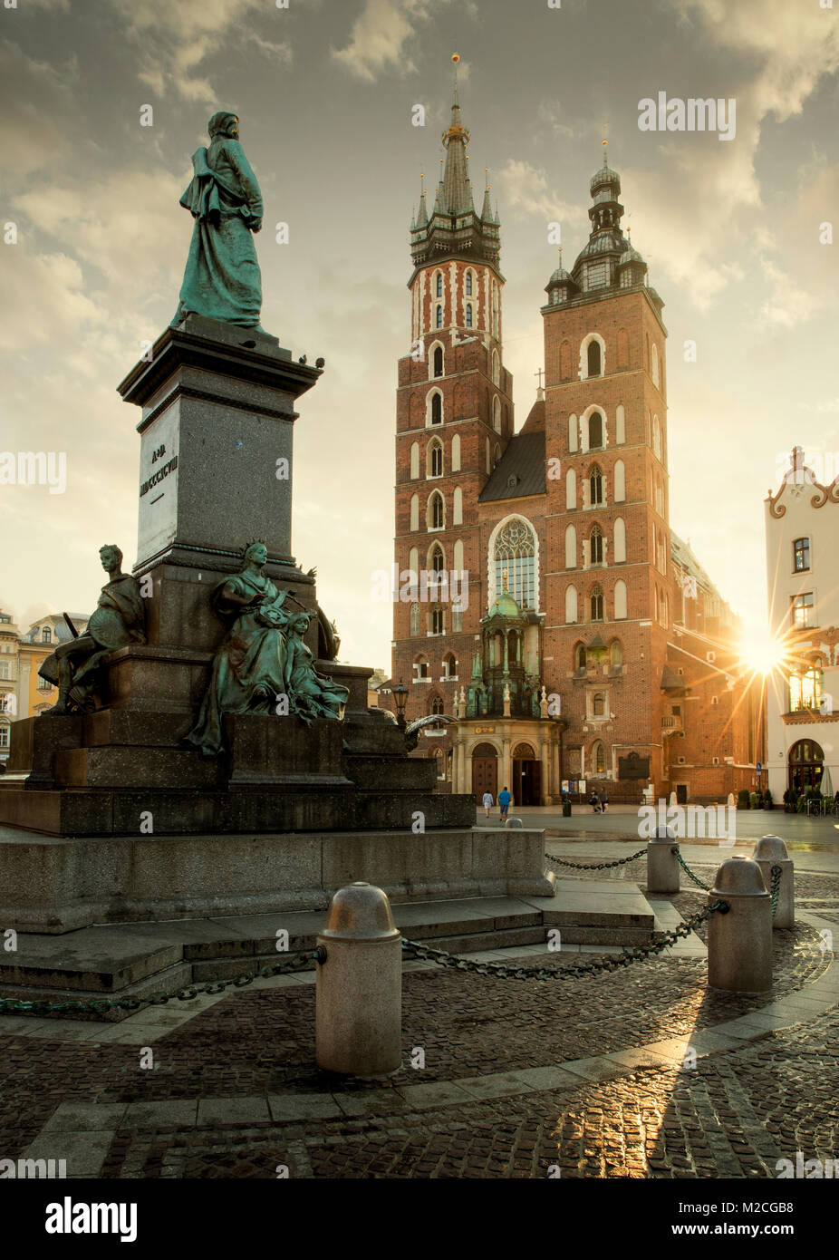 Old city center view with Adam Mickiewicz monument and St. Mary's church in Krakow Stock Photo
