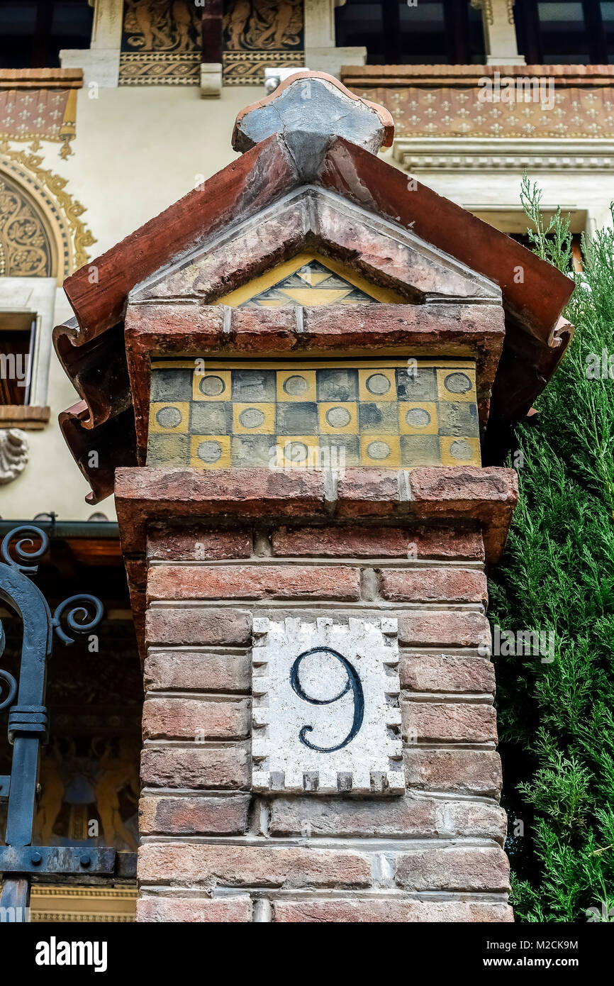 House number nine, 9. In front of an ancient luxury residential apartment building in the Coppede quarter. Art Deco style. Rome, Italy, EU. Close up. Stock Photo