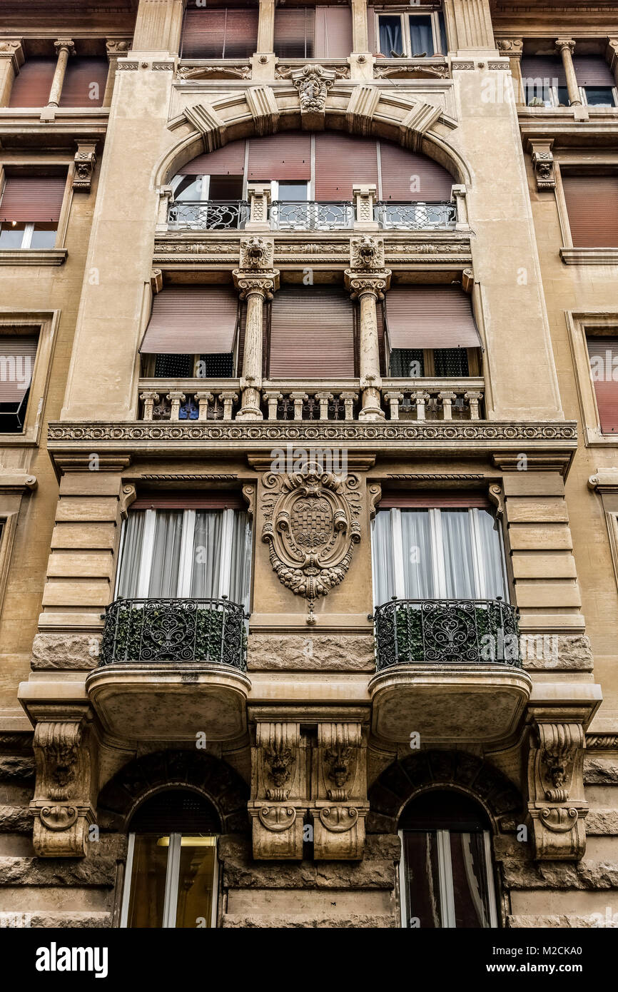 House building exterior facade with antique windows and balconies. Architect Gino Coppedè. Art Deco style. Rome, Italy, EU. Close up, low angle view. Stock Photo