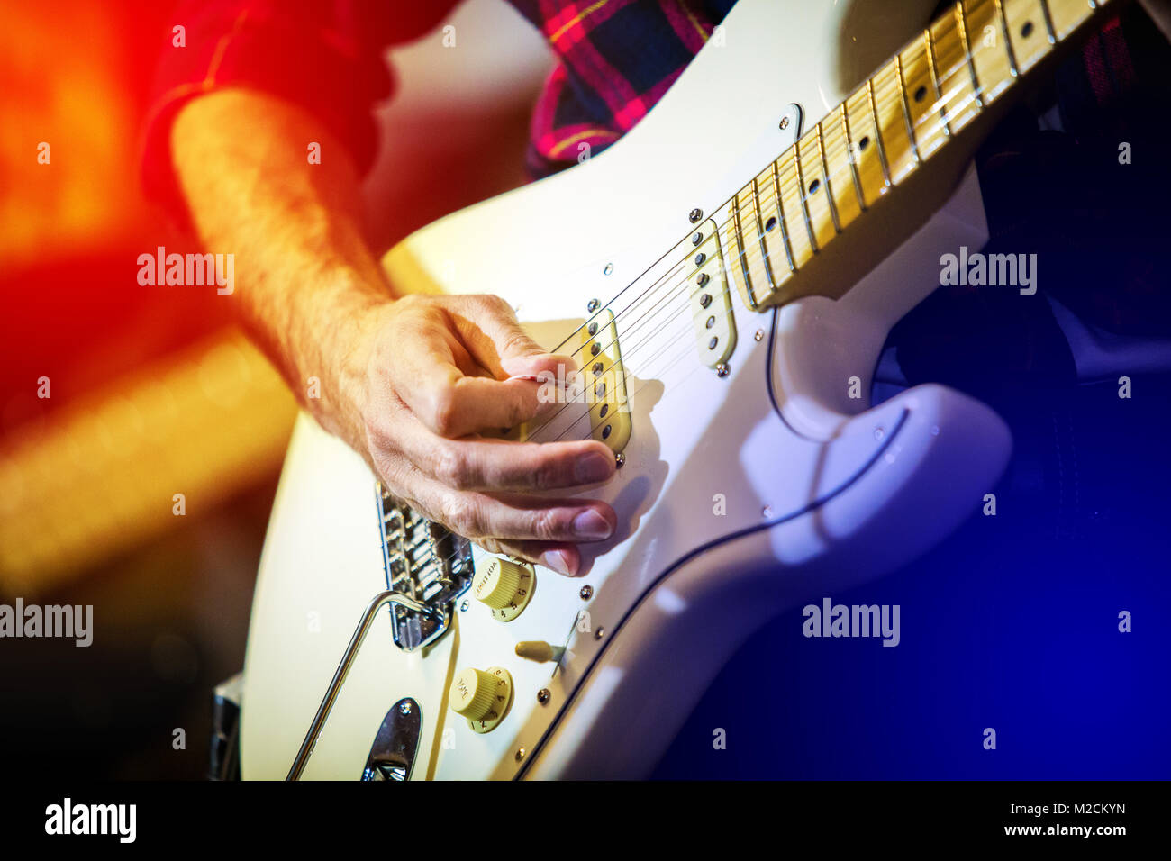 Artist playing electric guitar on the stage solo Stock Photo Alamy