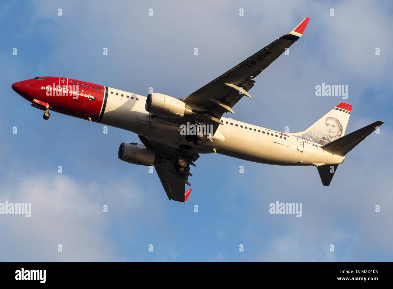 A Norweigan Air Shuttle Boeing 737-800 aircraft on final approach to London Gatwick airport on a January morning Stock Photo