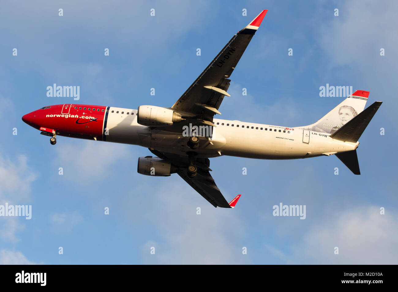 A Norweigan Air Shuttle Boeing 737-800 aircraft on final approach to London Gatwick airport on a January morning Stock Photo