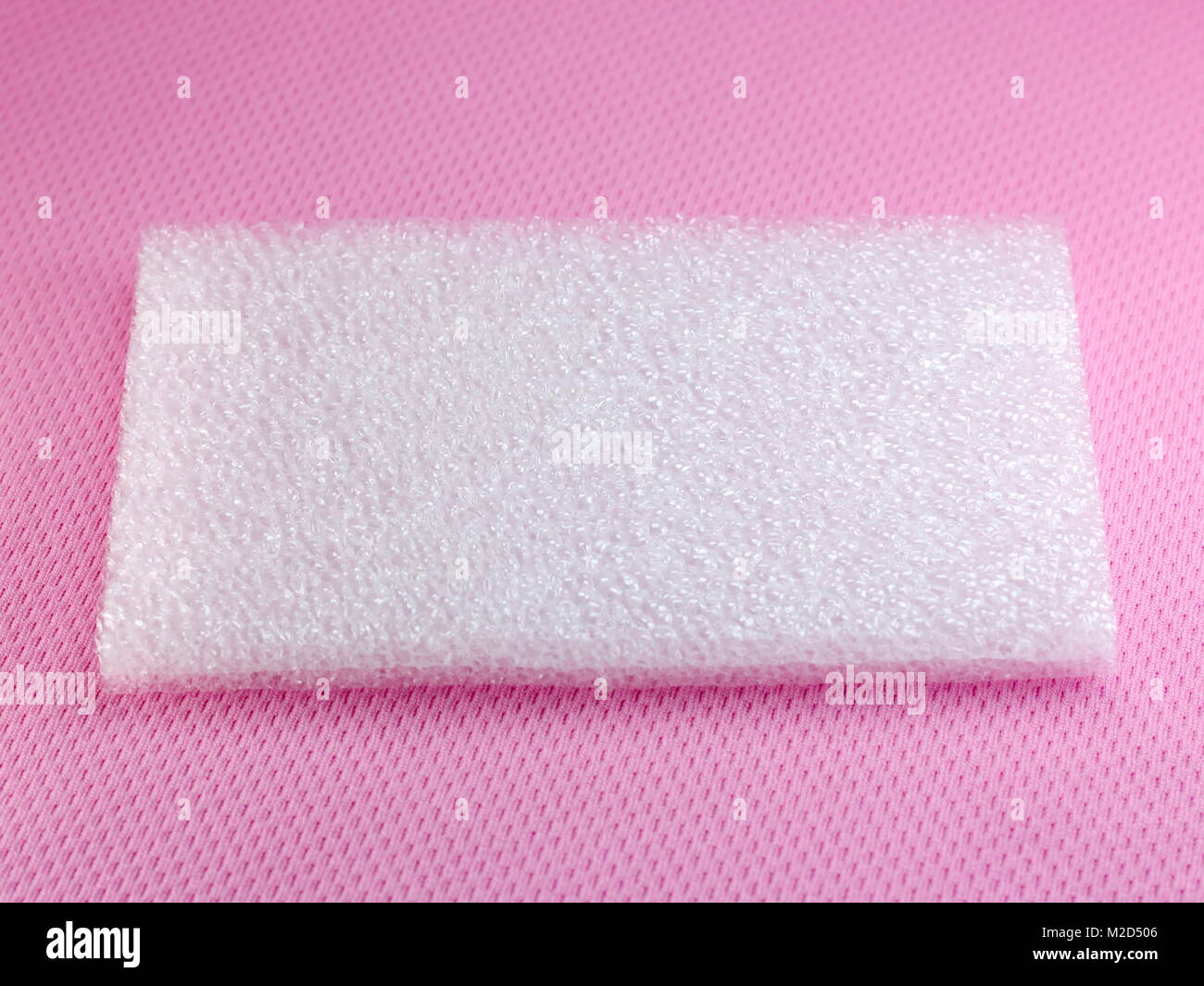 Shockproof material Polyethelene foam on pink background Stock Photo