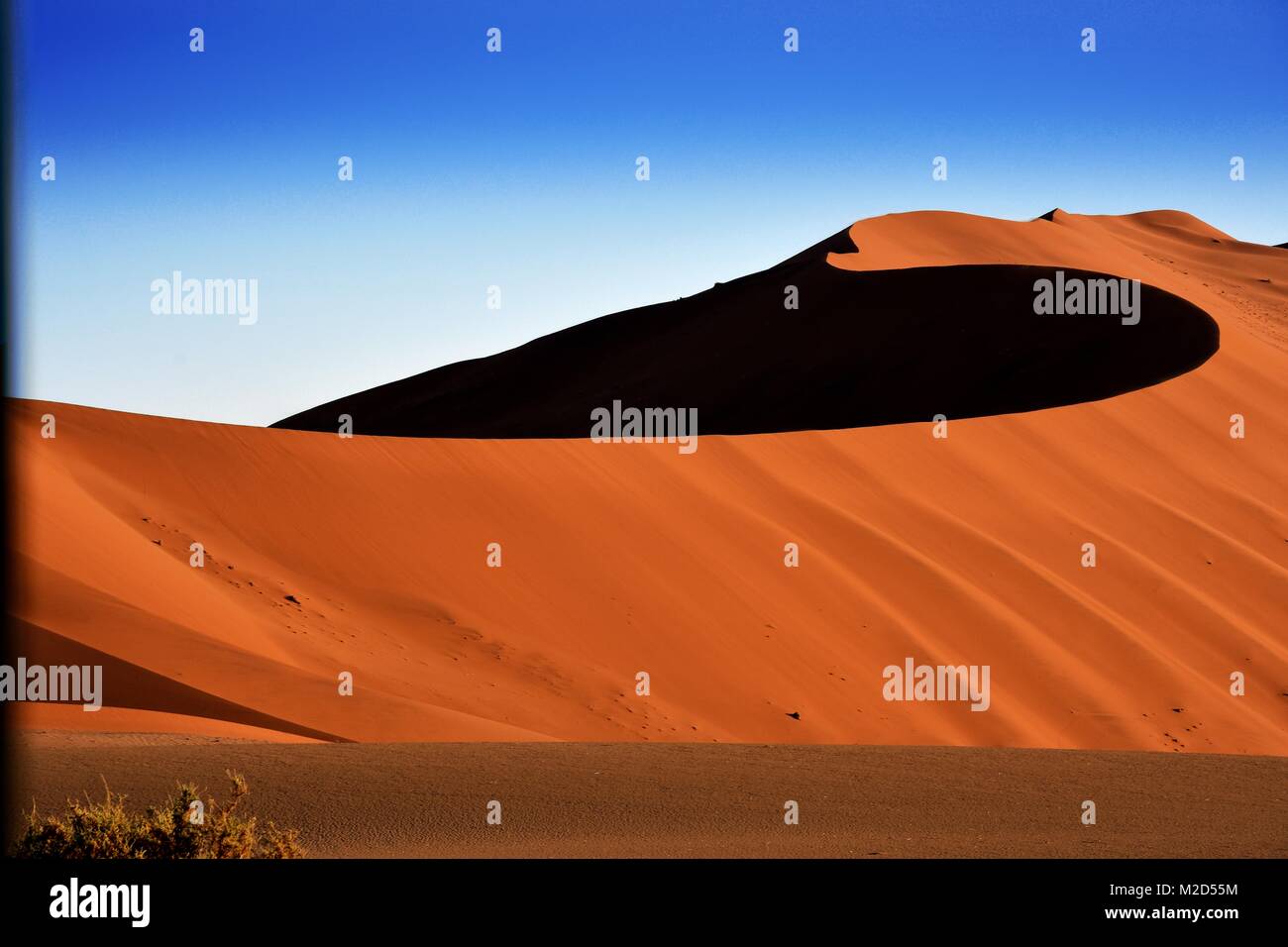 Swirling orange sand dune in Sossusvlei, Namib Desert, Namibia Stock Photo