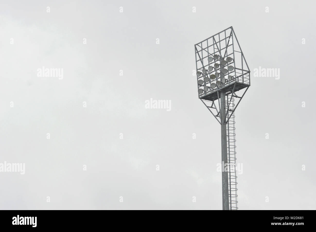 stadium light poles with white clouds and blue sky backgrounds Stock