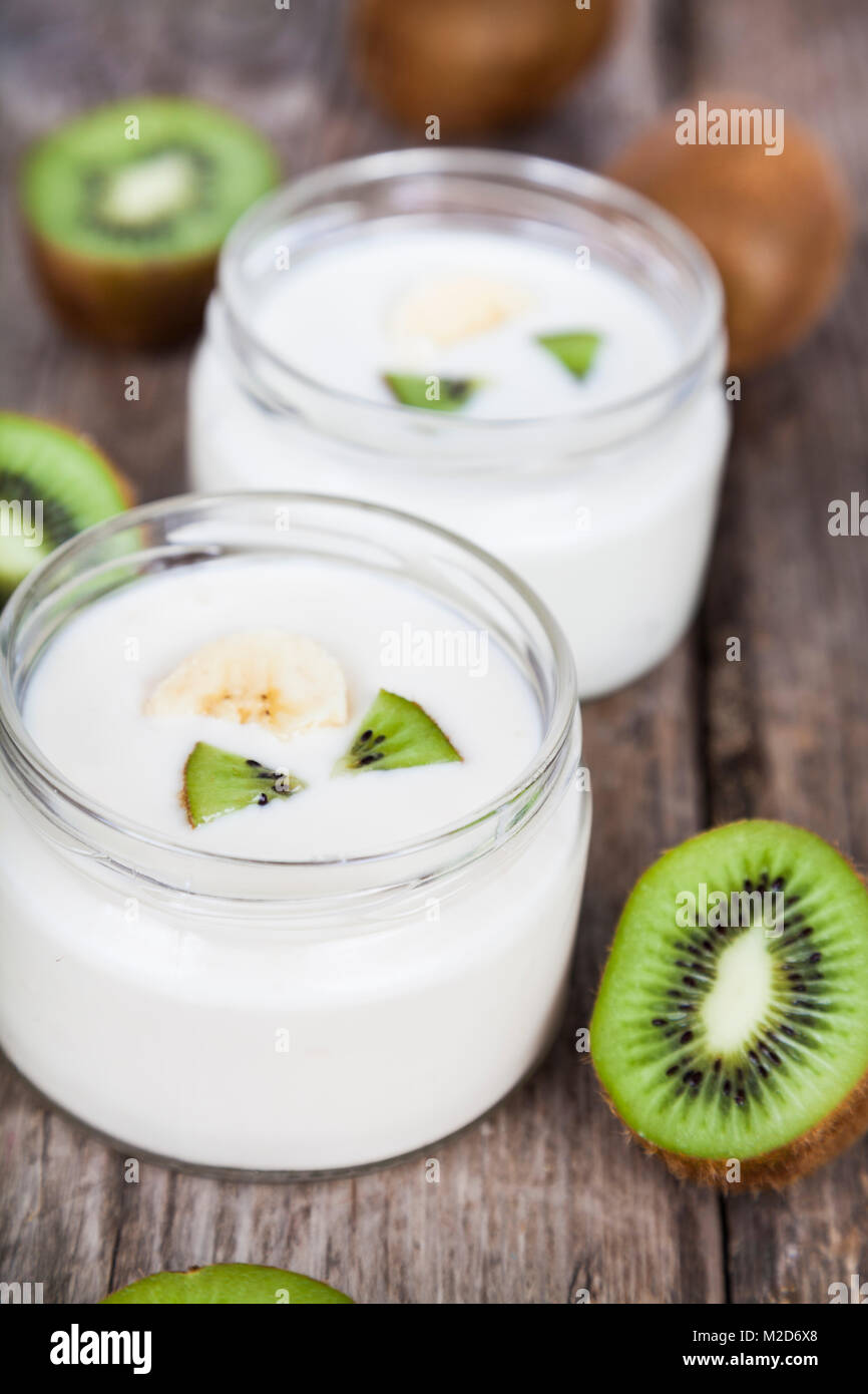 Yogurt with kiwi on a wooden background. Tasty breakfast. Healthy eating Stock Photo Alamy
