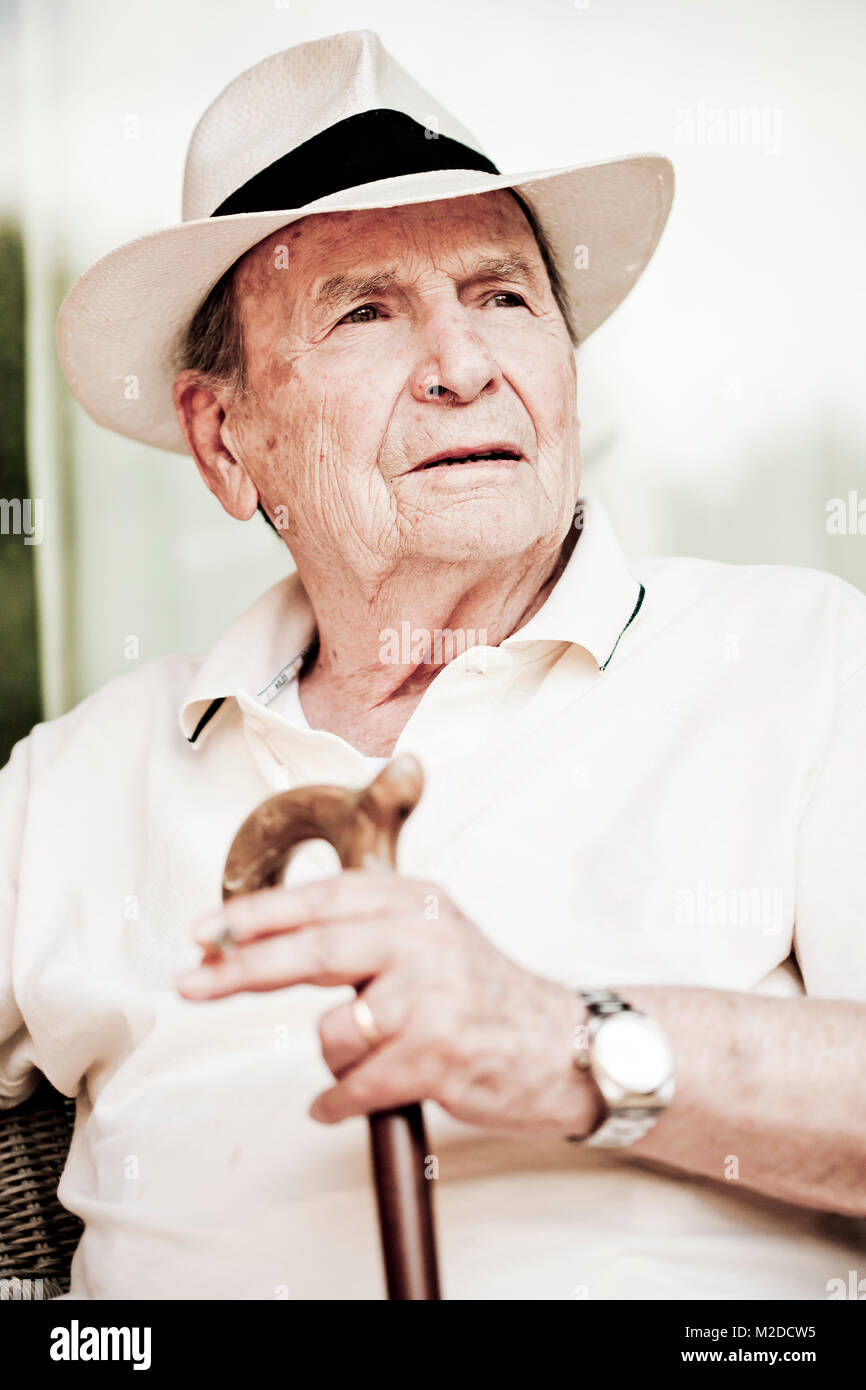 an old man with a walking stick Stock Photo - Alamy
