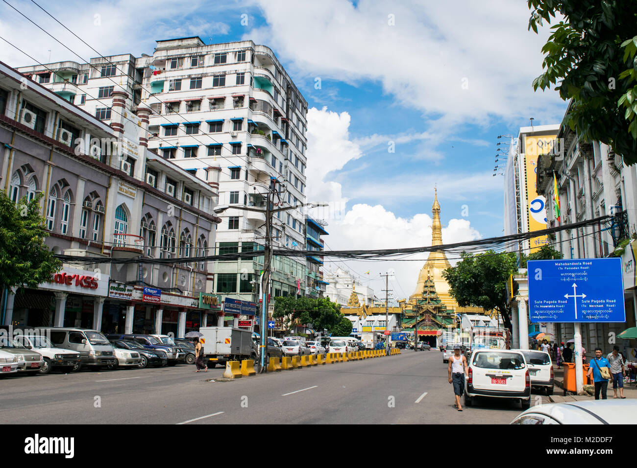 Exterior of Buddhist Sule Pagoda and golden stupa, at end of busy urban road used as a traffic island roundabout in downtown Yangon Myanmar Burma Asia Stock Photo