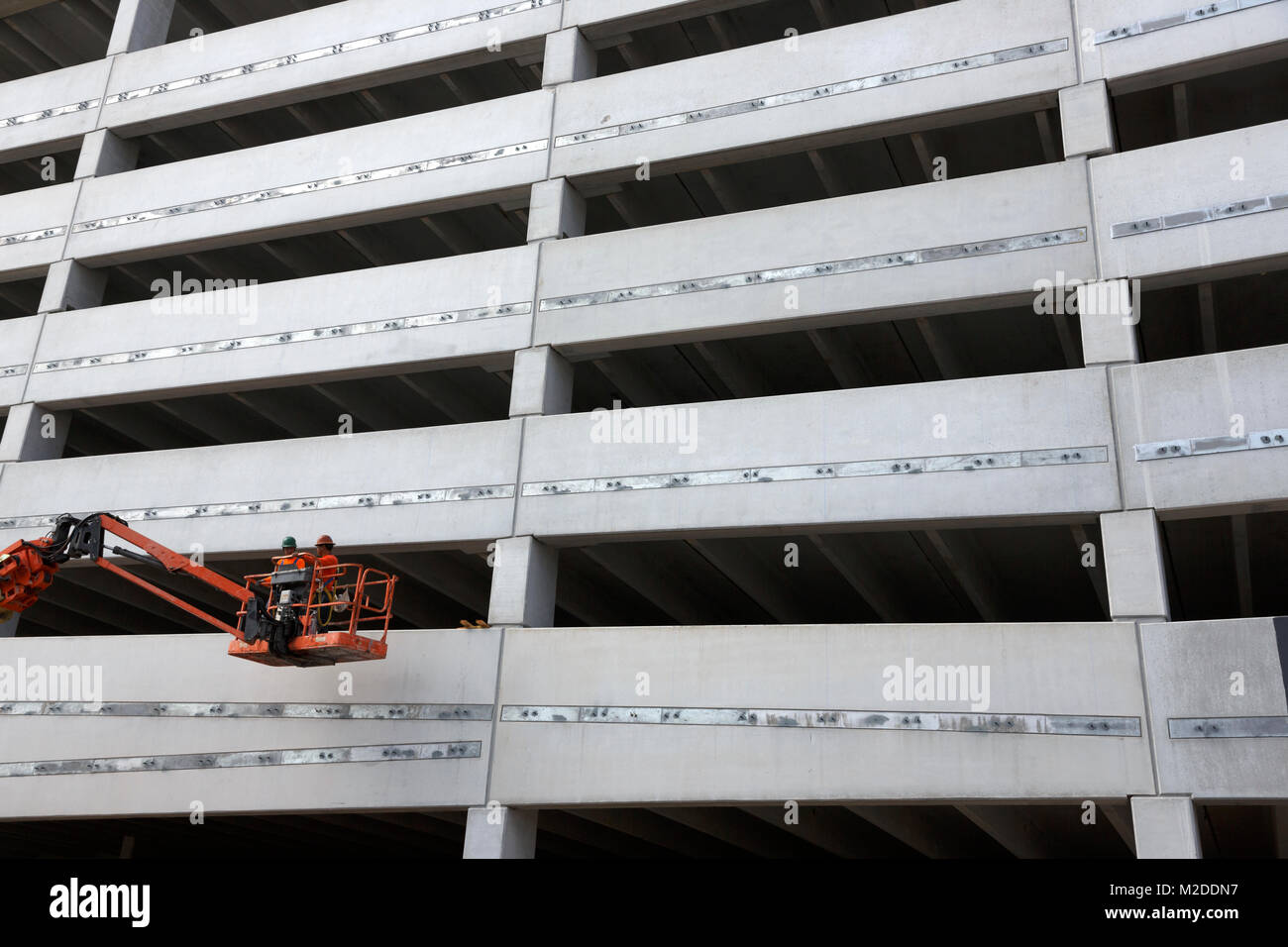 workers in a bucket lift, construction site, Miami, Florida Stock Photo