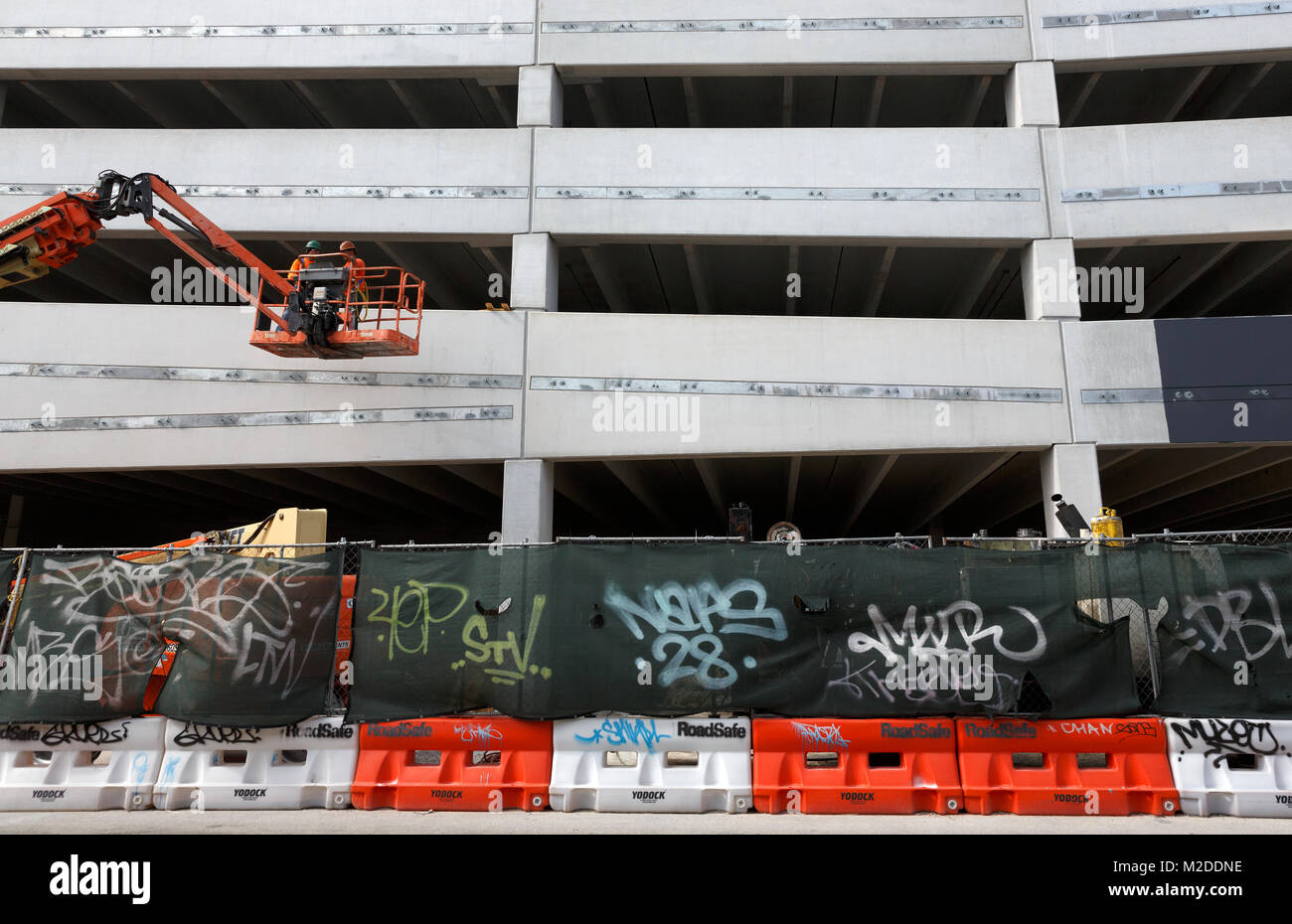 workers in a bucket lift, construction site, Miami, Florida Stock Photo