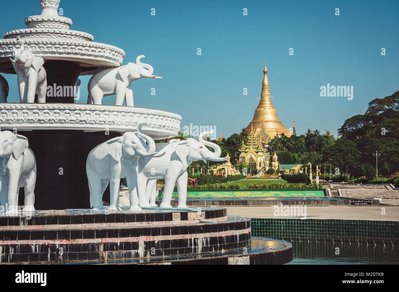 White elephant fountain in Peoples Park, Yangon, Myanmar Burma with the famous Shwedagon Pagoda. Stock Photo