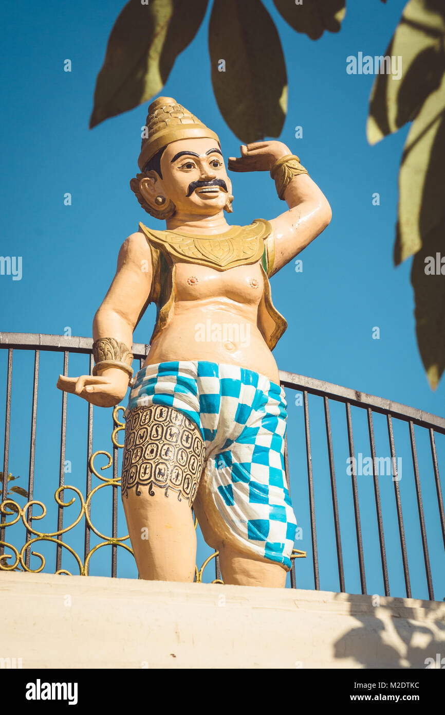 Burmese figure outside the famous Shwedagon Pagoda in Yangon, Myanmar. Stock Photo