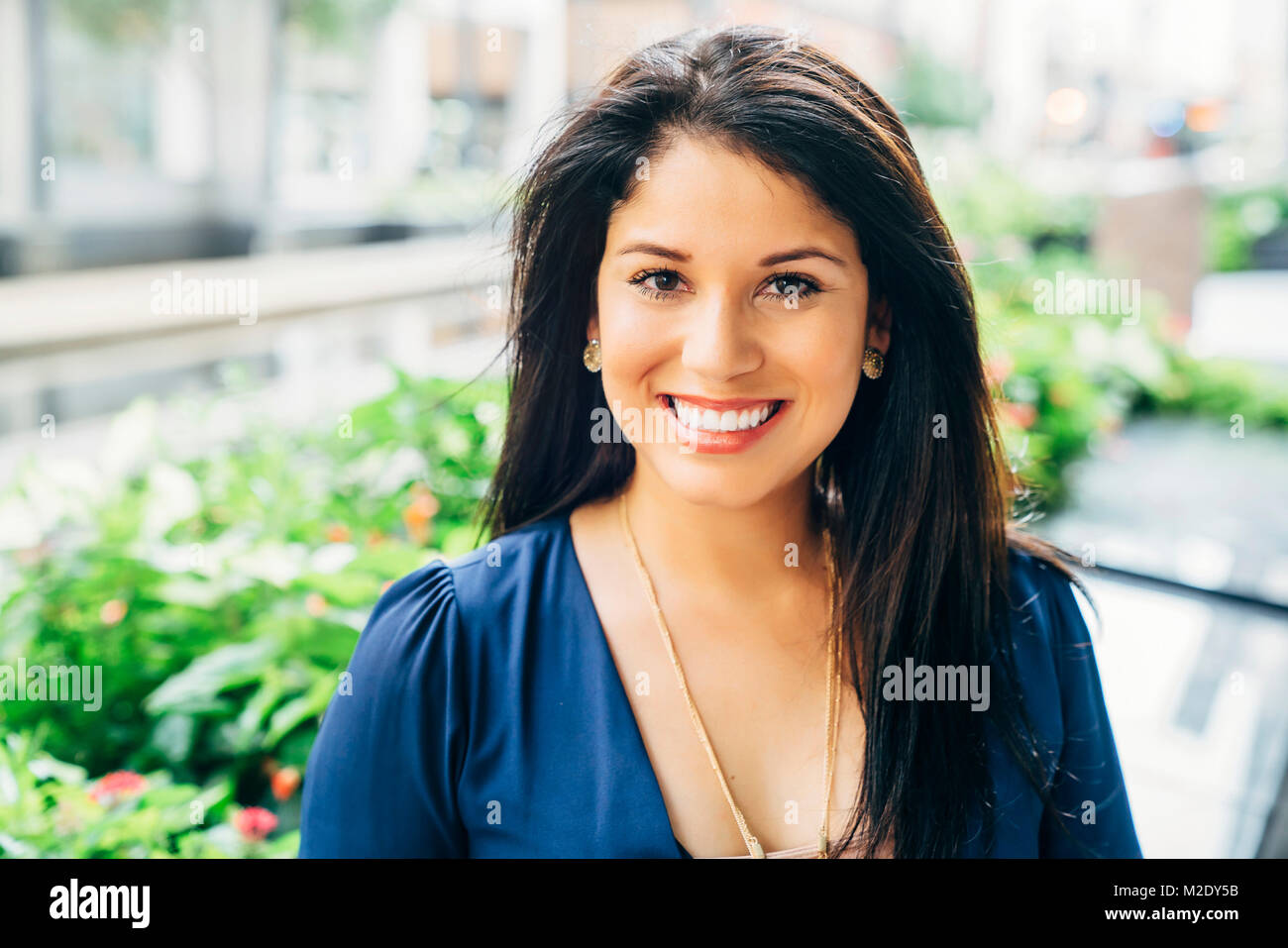 Close up portrait of smiling Hispanic woman Stock Photo - Alamy