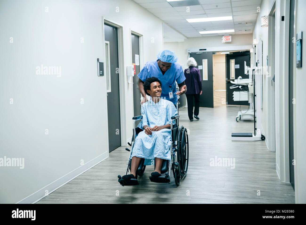 Nurse pushing boy in wheelchair Stock Photo