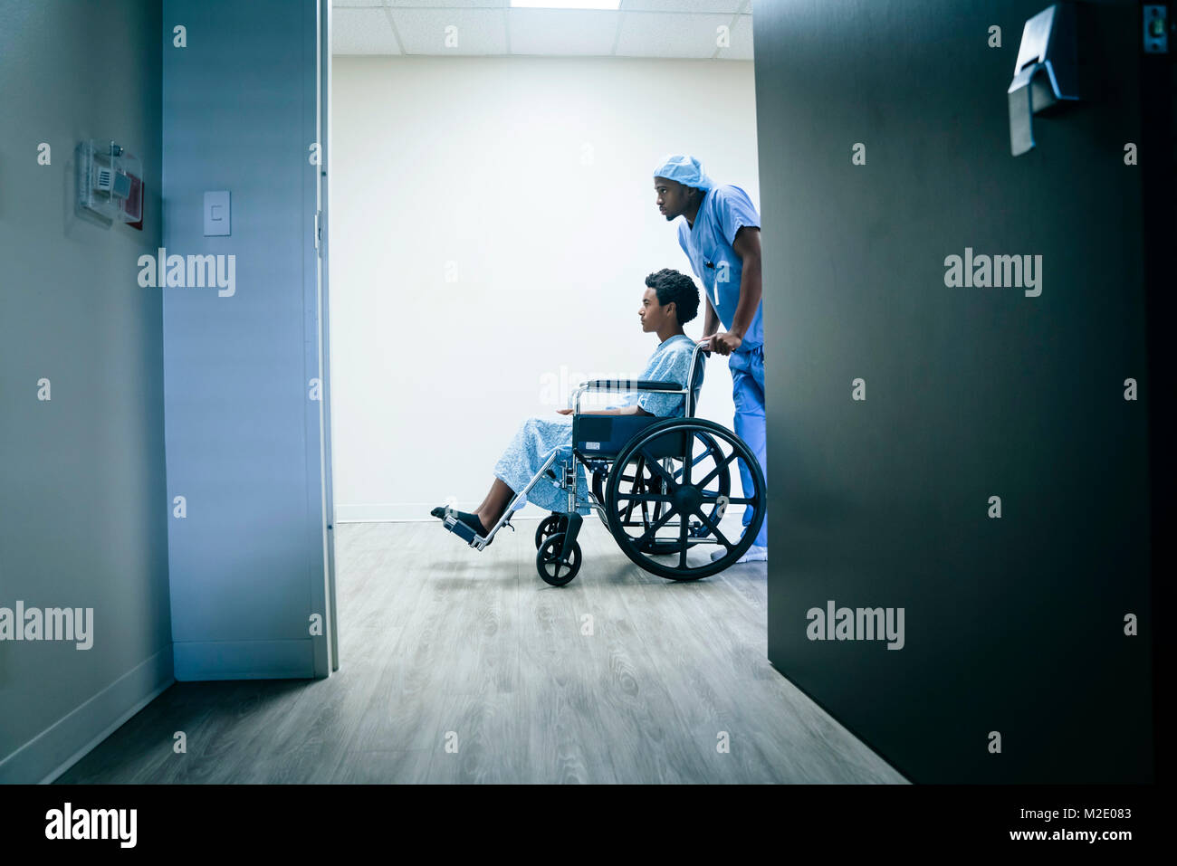 Nurse pushing boy in wheelchair Stock Photo