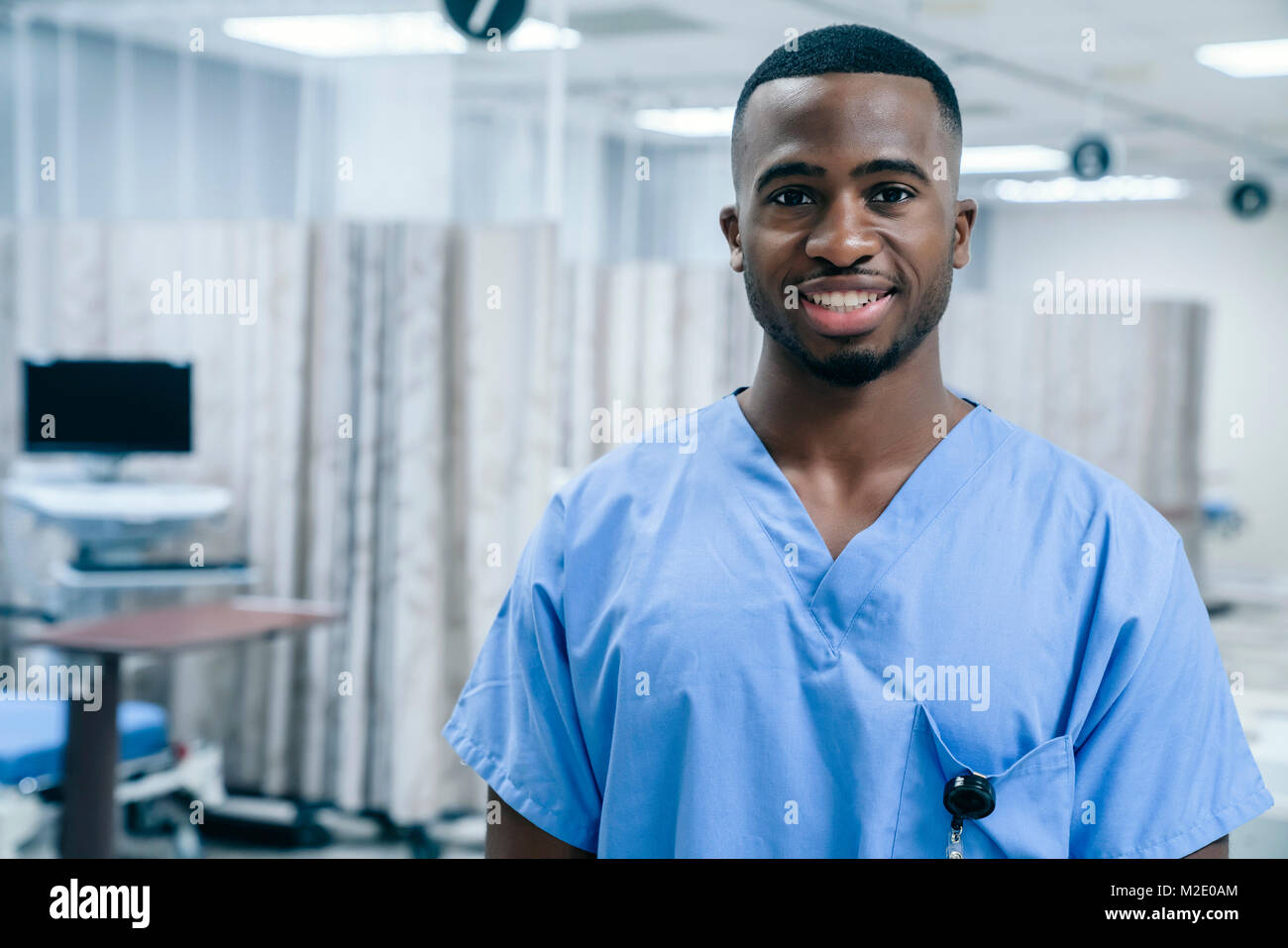 Portrait of smiling Black doctor in hospital Stock Photo