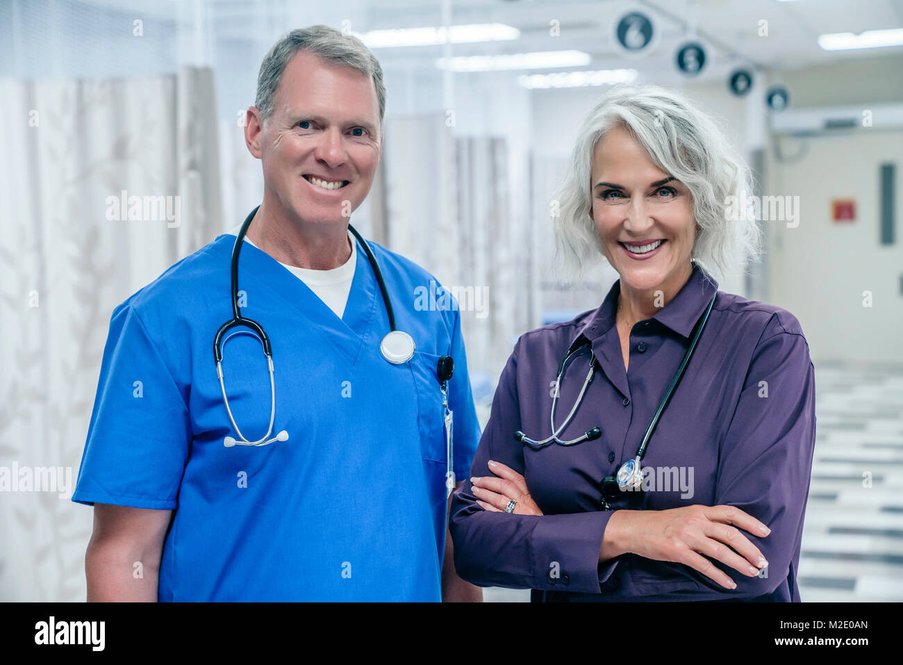 Portrait of smiling Caucasian doctors in hospital Stock Photo - Alamy
