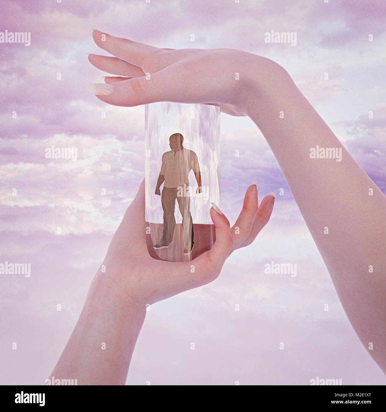 Hands of woman trapping man in glass container Stock Photo