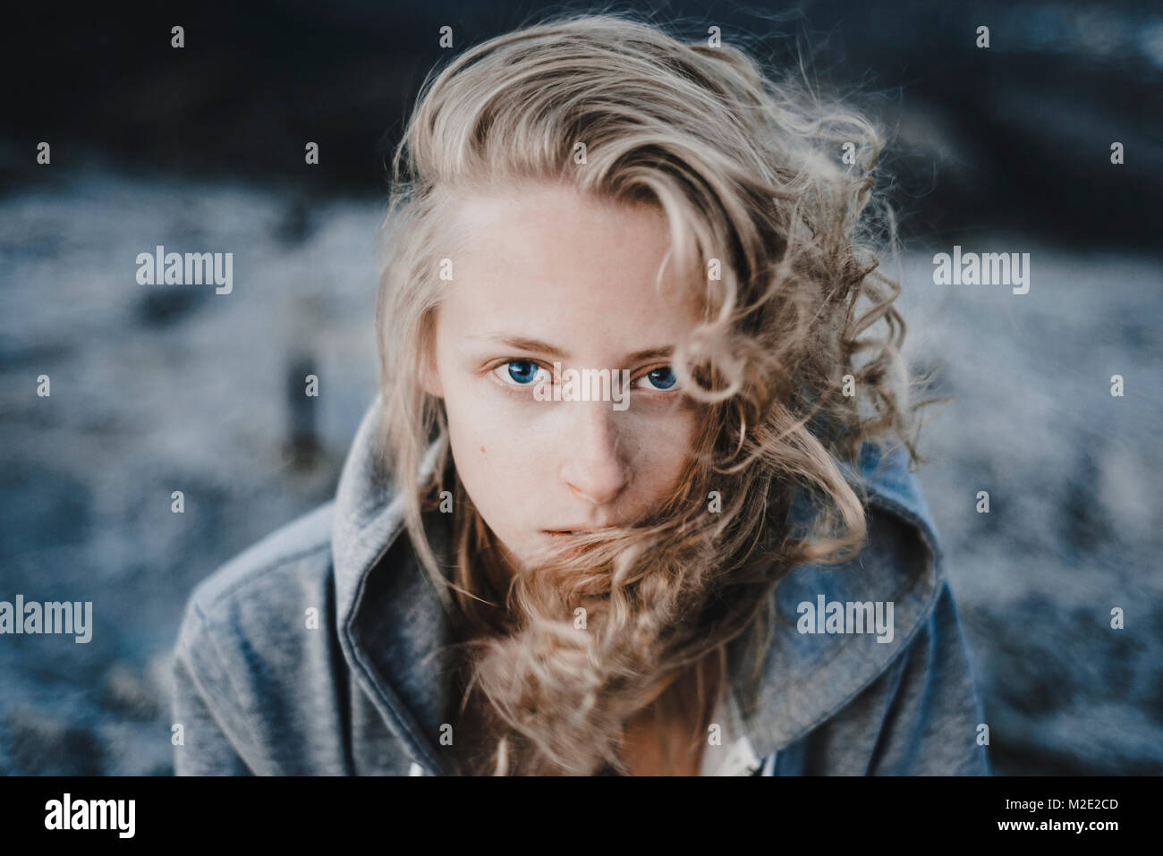Close up of wind blowing hair of Caucasian woman Stock Photo