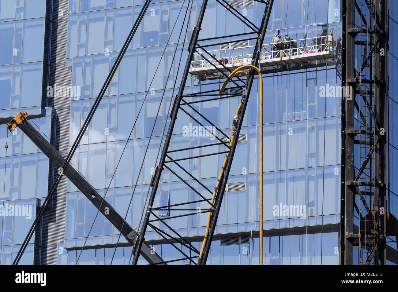Highrise window washers on scaffolding Stock Photo