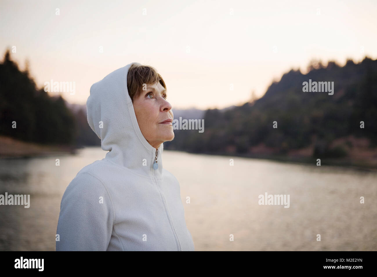 Female person wearing hood hi-res stock photography and images - Alamy
