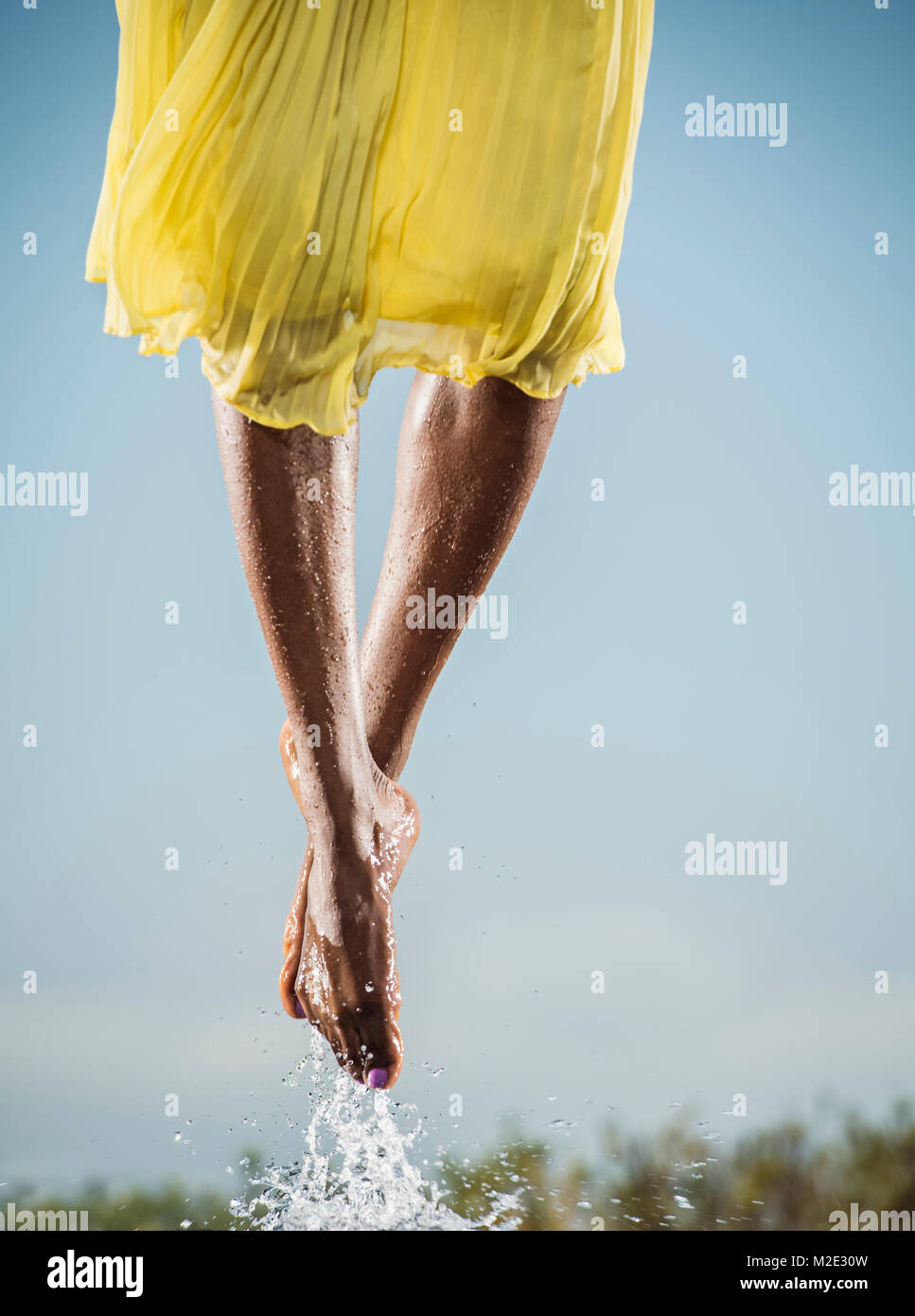 Feet of Black dancing jumping in water Stock Photo Alamy