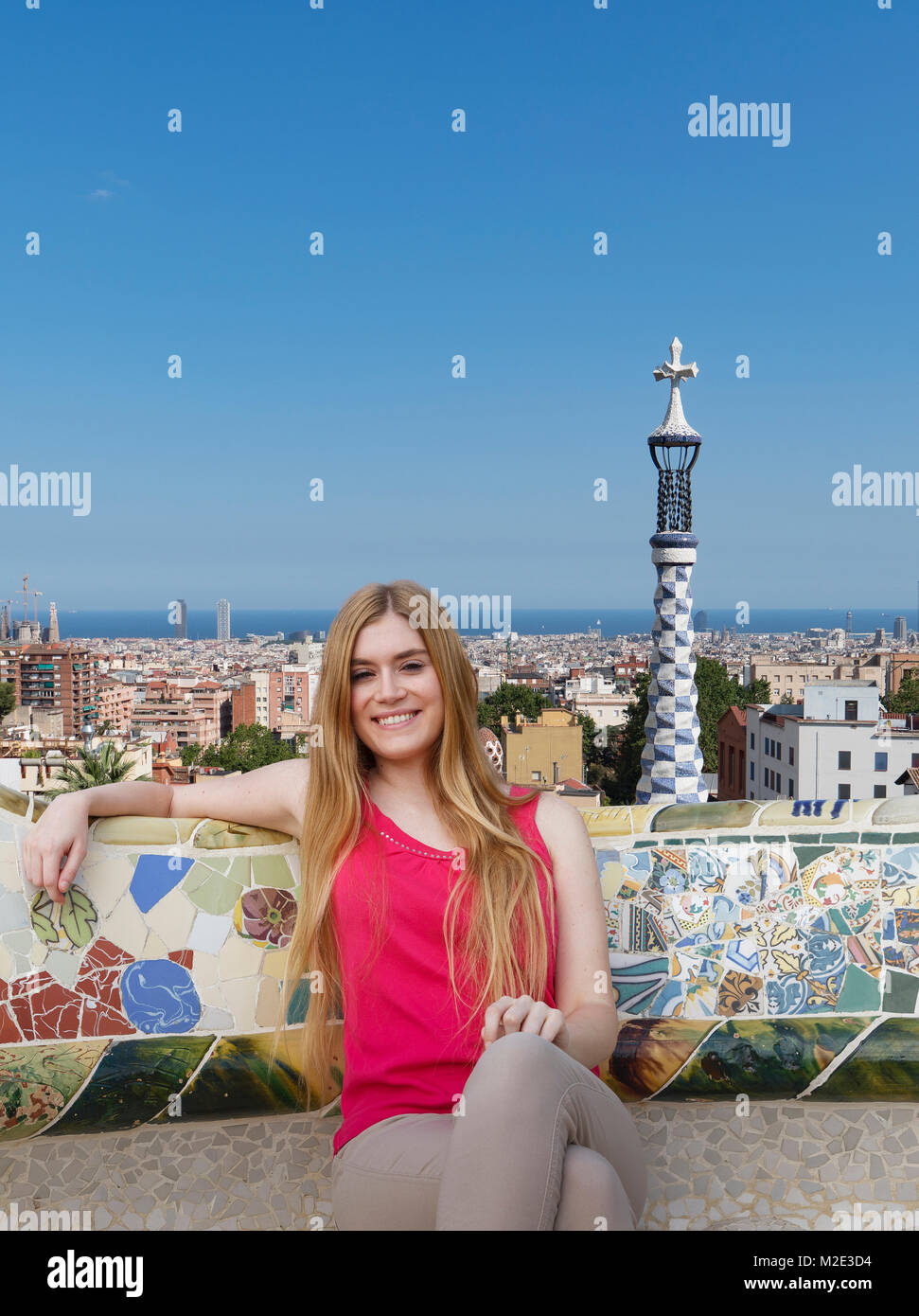 Portrait of smiling Caucasian woman relaxing on roof Stock Photo
