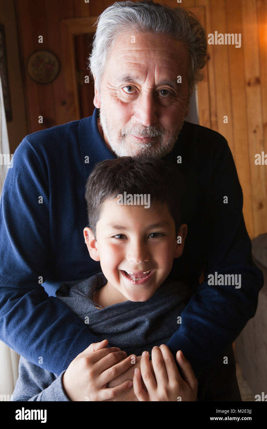 Portrait Of Smiling Hispanic Grandfather And Grandson Stock Photo Alamy