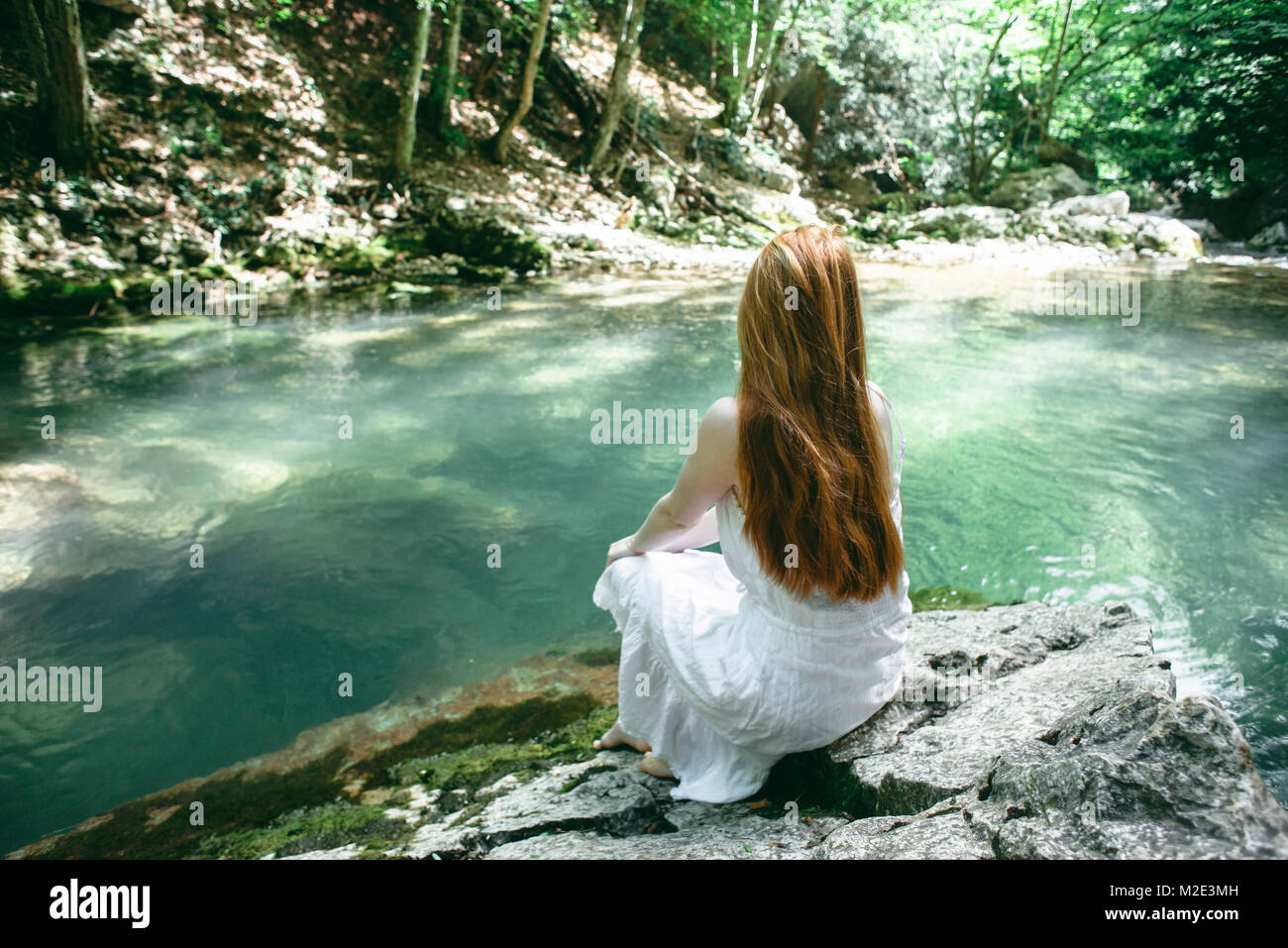 Woman sitting near river hi-res stock photography and images - Alamy