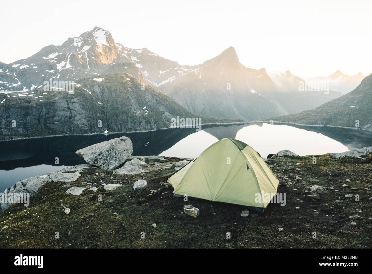 Camping tent near mountain lake Stock Photo