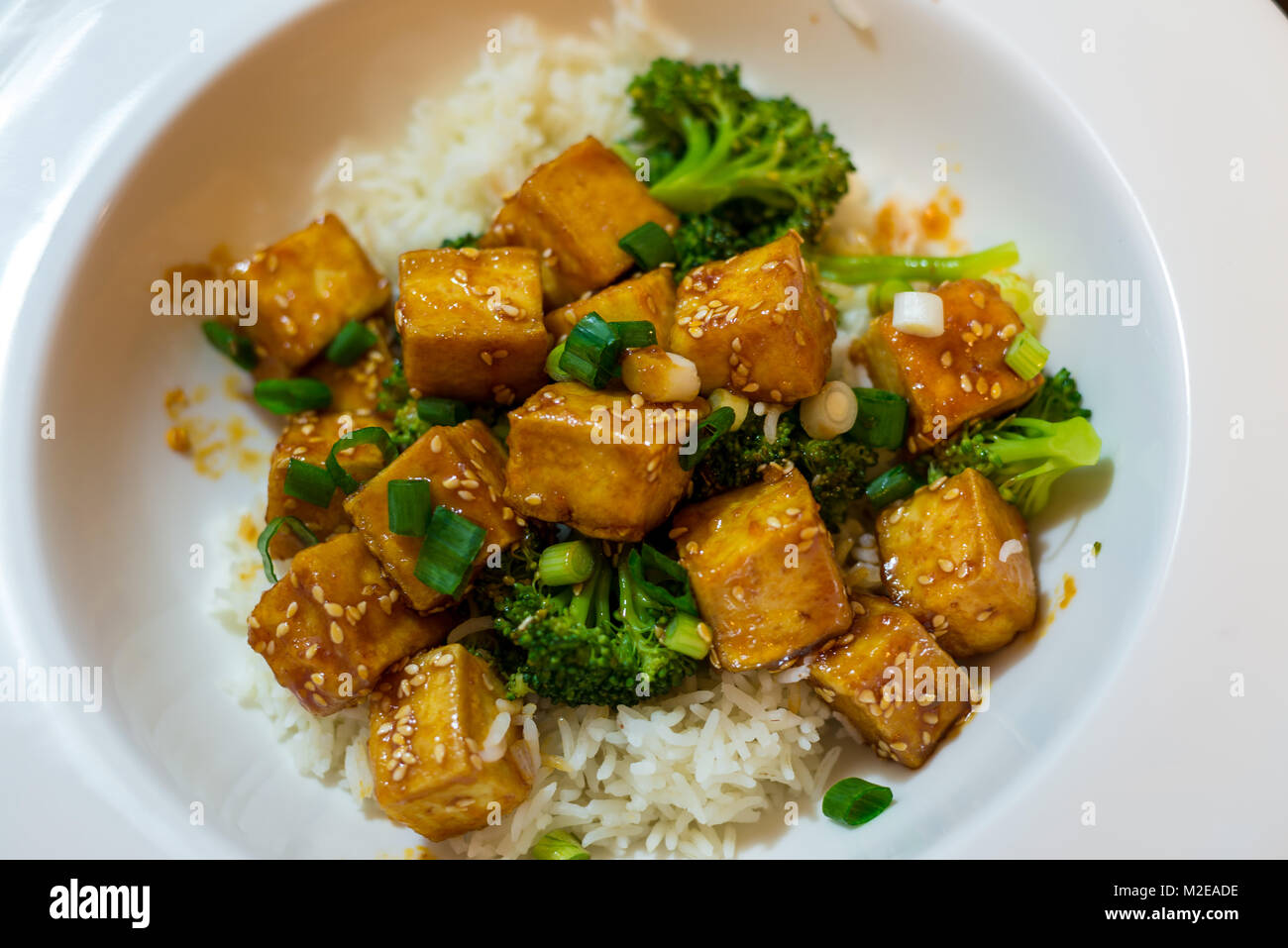 Chili honey tofu with rice and broccoli Stock Photo Alamy