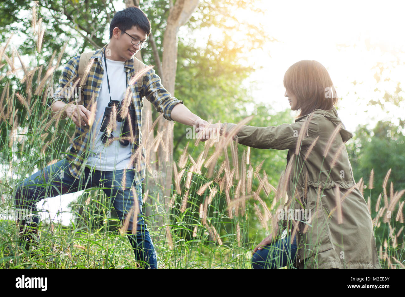 Couple of Asian tourists walking is a wild adventure Stock Photo - Alamy