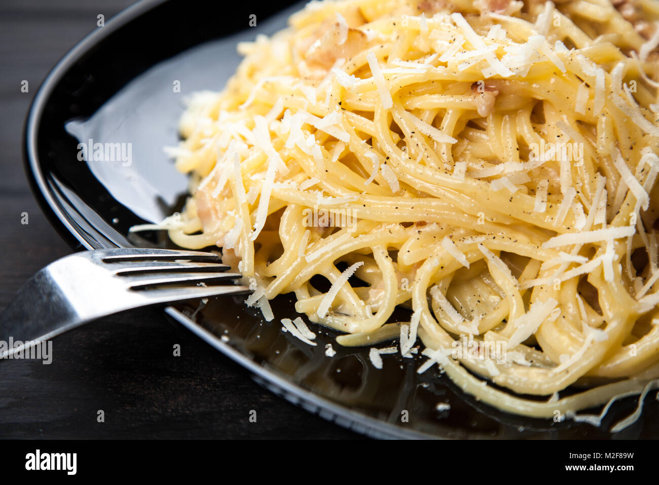 Spaghetti carbonara with egg and pancetta Stock Photo