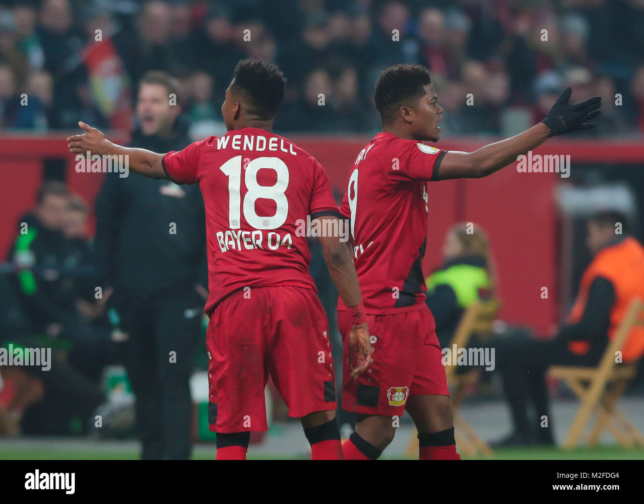 Leverkusen, Germany. 6th Feb, 2018. Football cup quarterfinals, Bayer 04 Leverkusen vs SV Werder Bremen: Wendell (B04, L) and Leon Bailey gesture. Credit: Juergen Schwarz/Alamy Live News Stock Photo