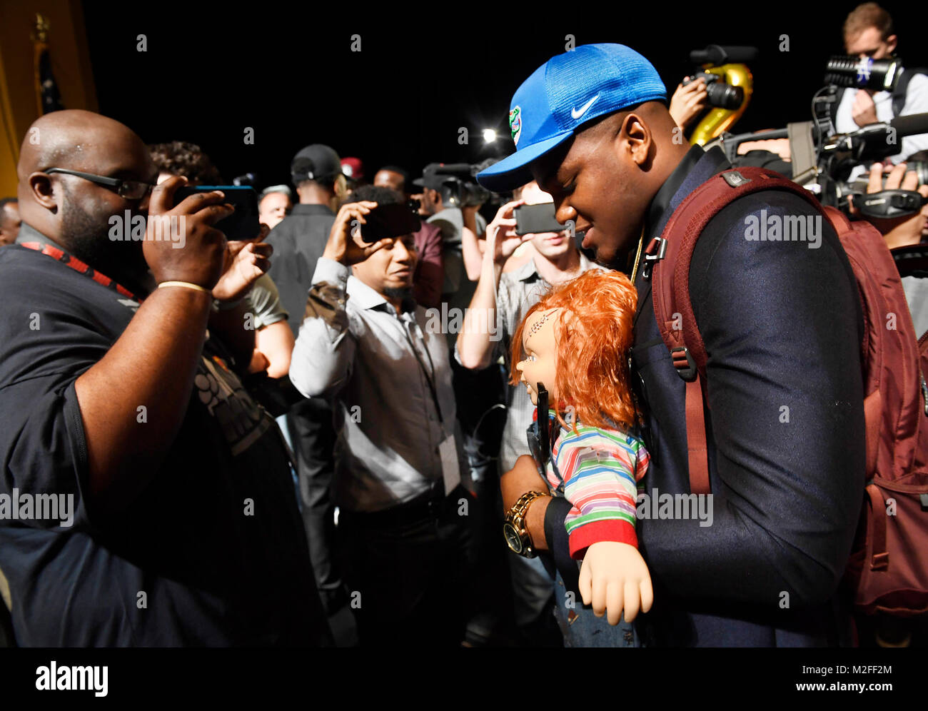 Plantation, Florida, USA. 18th Jan, 2018. fl-sp-ah-nsd-20180207-12 Andrew Chatfield holds his Chucky doll as heÃ¢â‚¬â„¢s surrounded by the press after signing to attend the University of Florida on National Signing Day at American Heritage in Plantation Wednesday morning. TAIMY ALVAREZ/SUN-SENTINEL Credit: Sun-Sentinel/ZUMA Wire/Alamy Live News Stock Photo