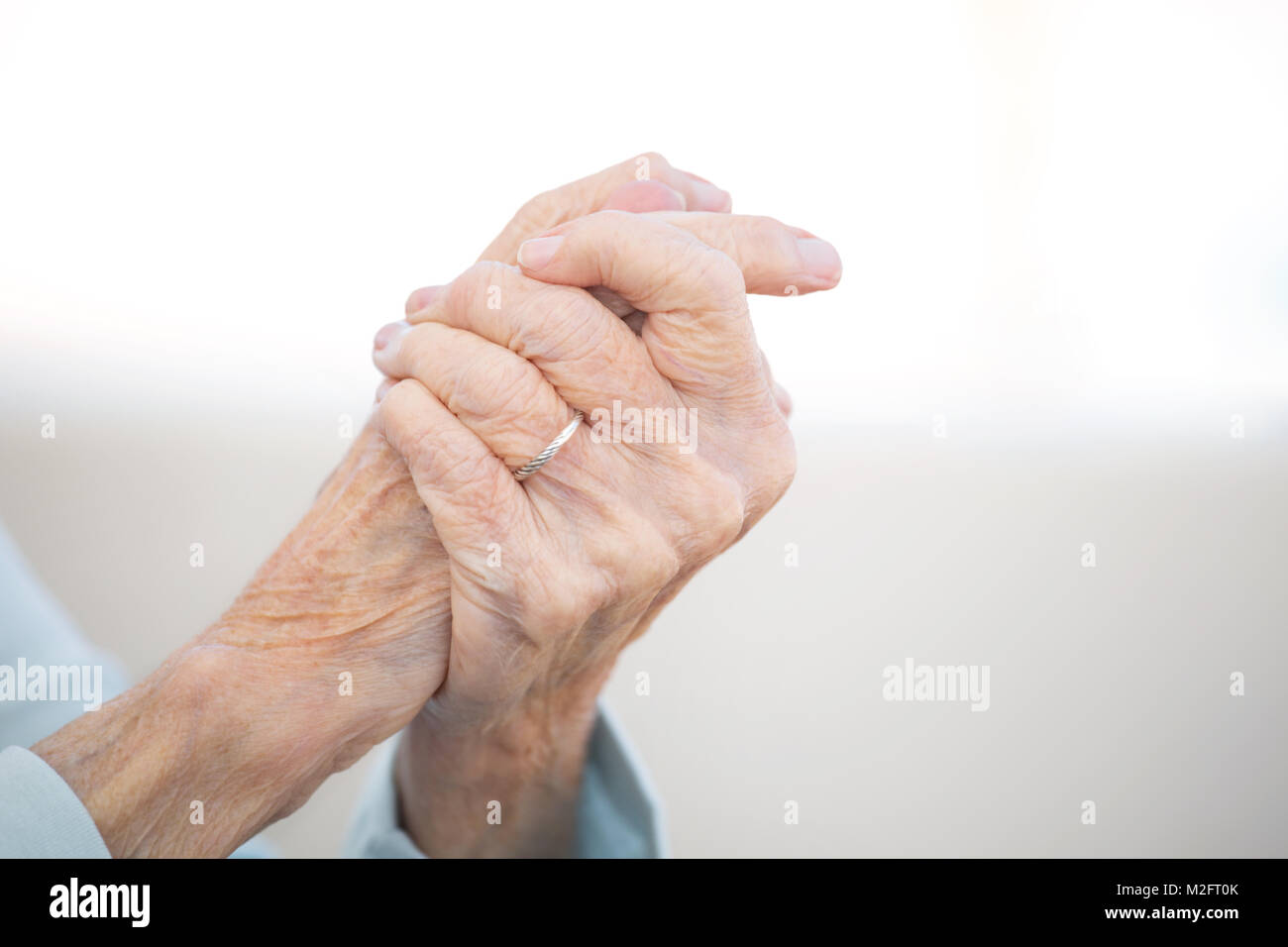 Portrait of a mature elderly woman with arthritis. Stock Photo