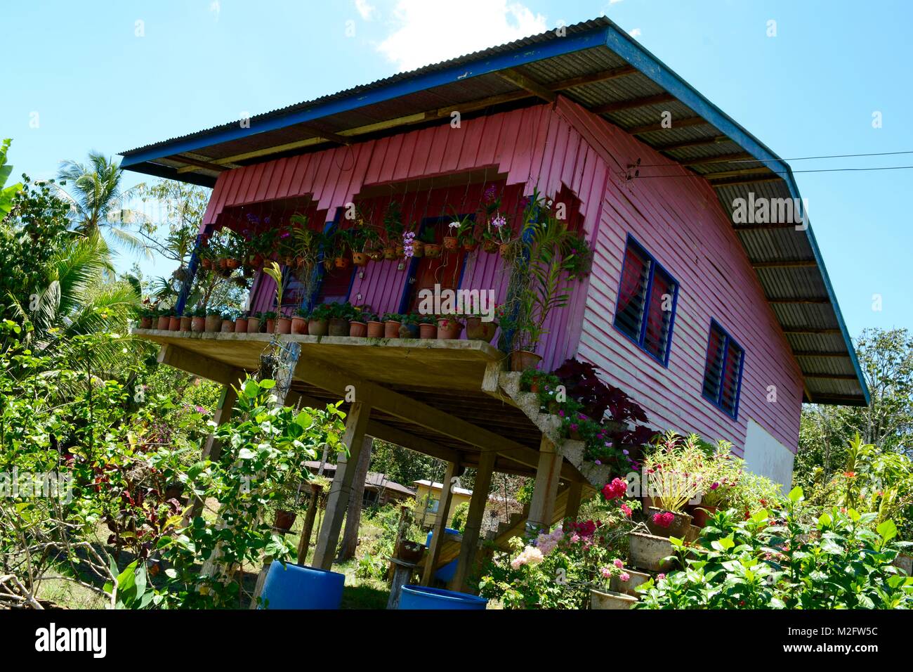 Colourful stilted house from Sarawak, Borneo Stock Photo