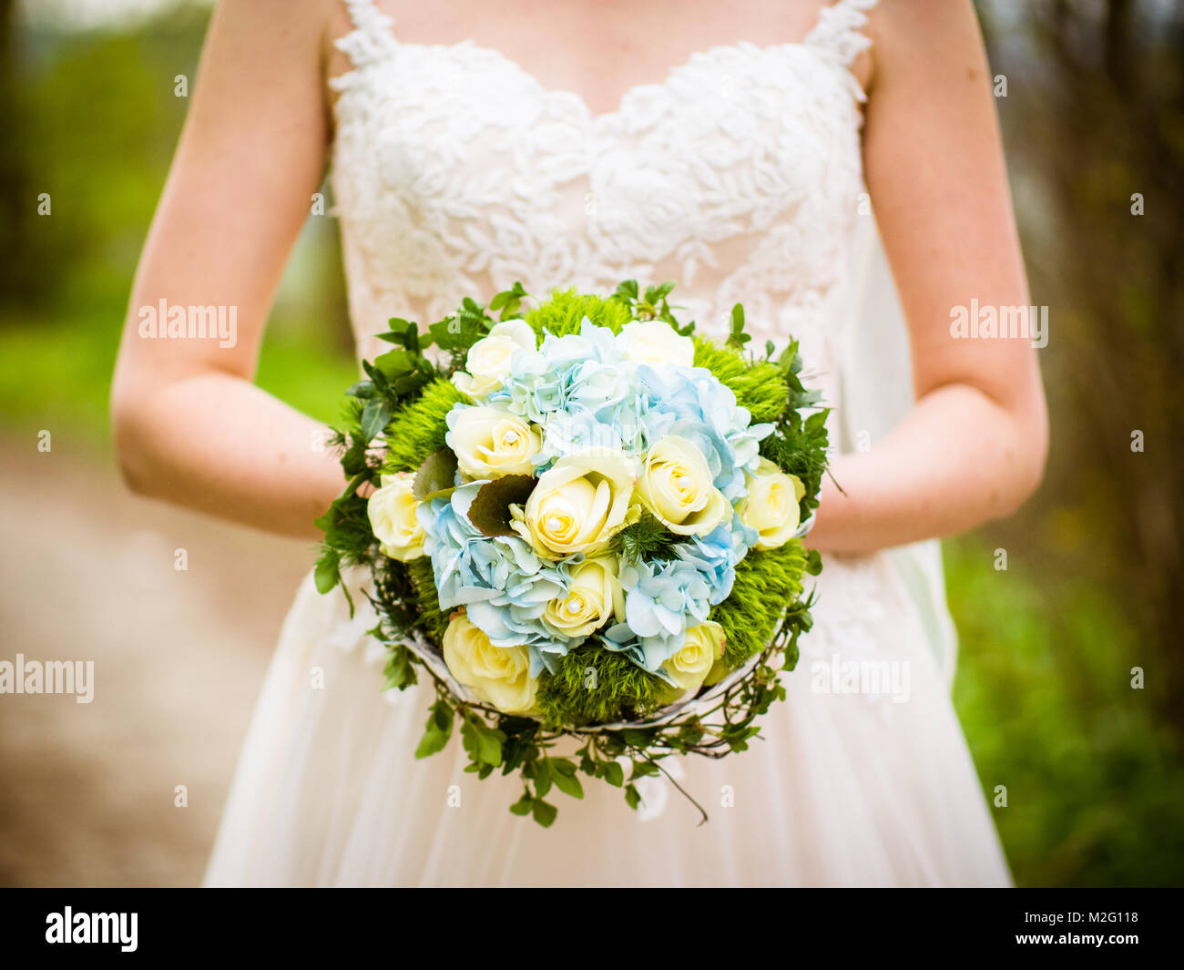 The bride holds the bridal bouquet Stock Photo