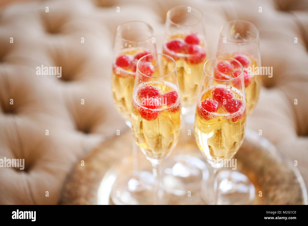 https://c8.alamy.com/comp/M2G1C0/champagne-glasses-on-silver-tray-party-and-holiday-celebration-concept-M2G1C0.jpg
