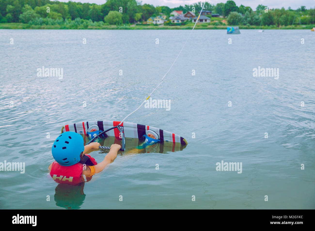 City Siauliai, Lithuania, water sport, woman wakebording, lake an fresh air. Travel photo. 2016 Stock Photo