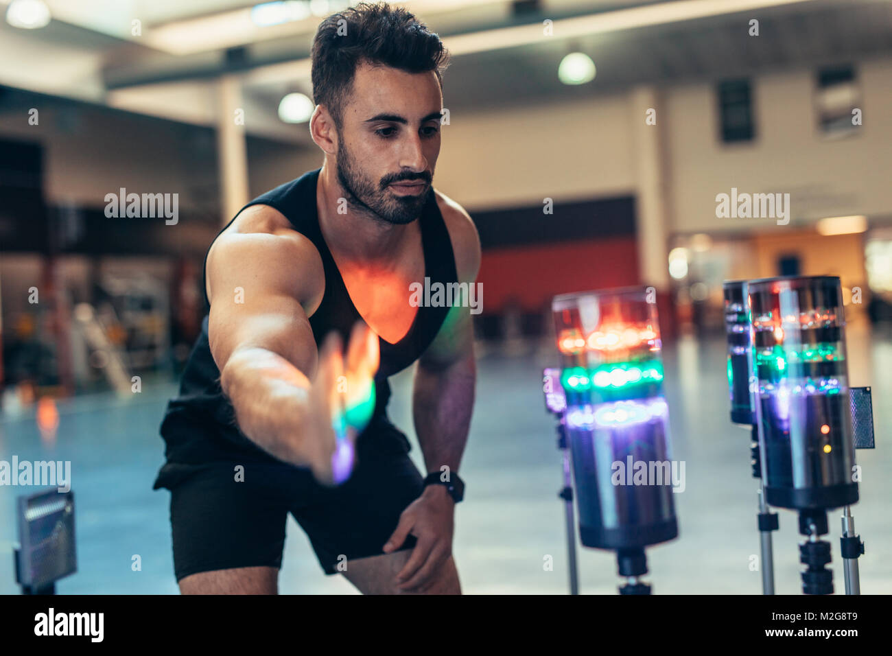 Reaction training session at gym. Athlete using a visual stimulus