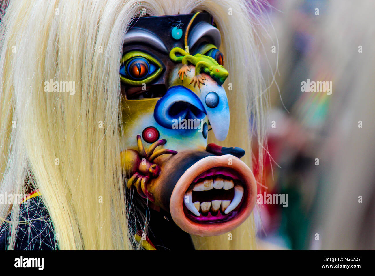 terrifying blue mask of warrior 'tastoan' in a traditional mexican carnival Stock Photo