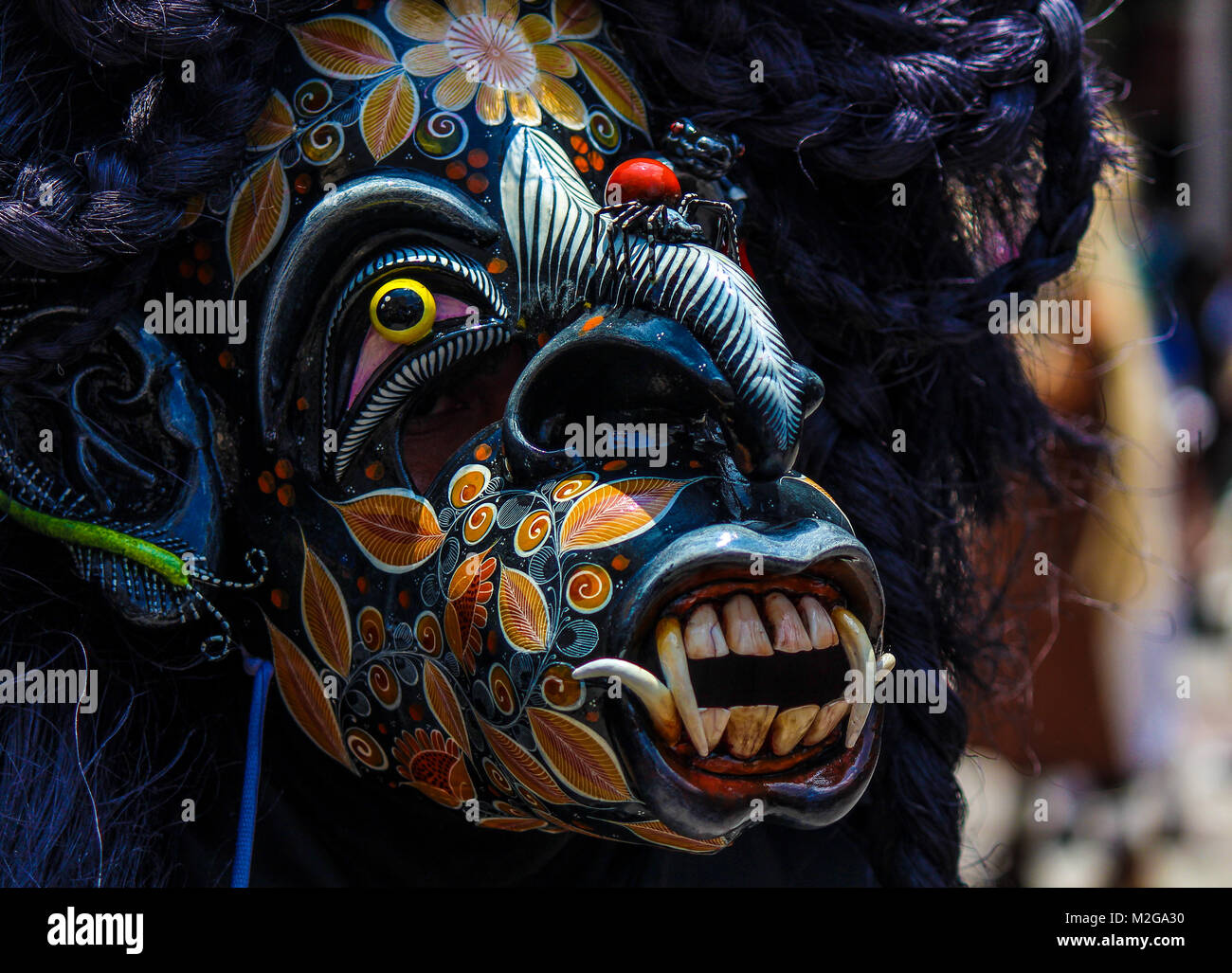 terrifying black mask of warrior 'tastoan' in a traditional mexican carnival Stock Photo