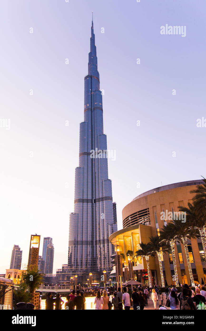 DUBAI, UNITED ARAB EMIRATES - FEBRUARY 5, 2018: Burj Khalifa and the Dubai mall building at dusk. With a total height of 829.8 m (2,722 ft) and a roof Stock Photo