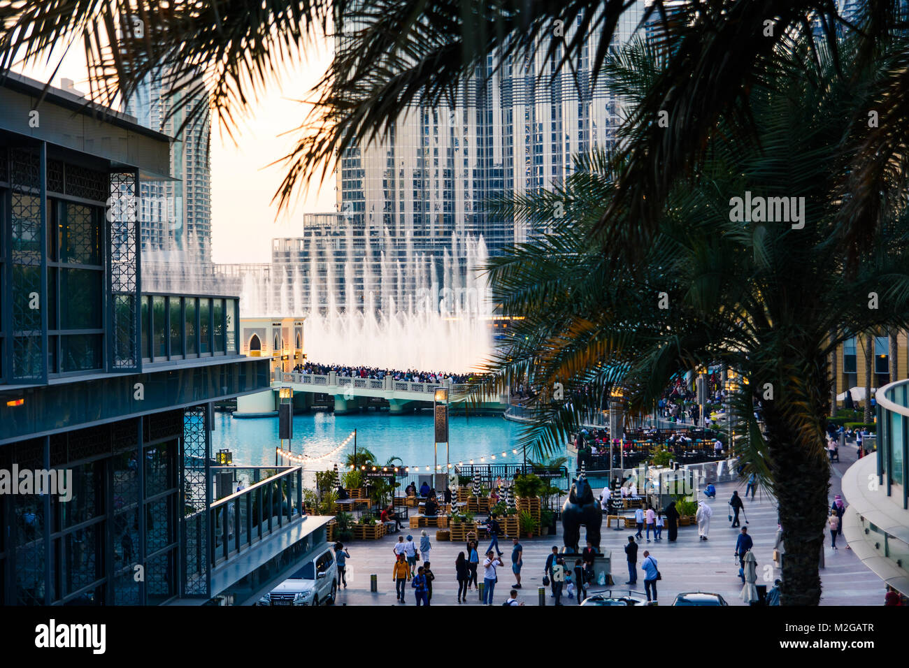 DUBAI, UNITED ARAB EMIRATES - FEBRUARY 5, 2018: Crowd gathers around the Dubai mall fountain to see the water show which attracts many tourist every d Stock Photo