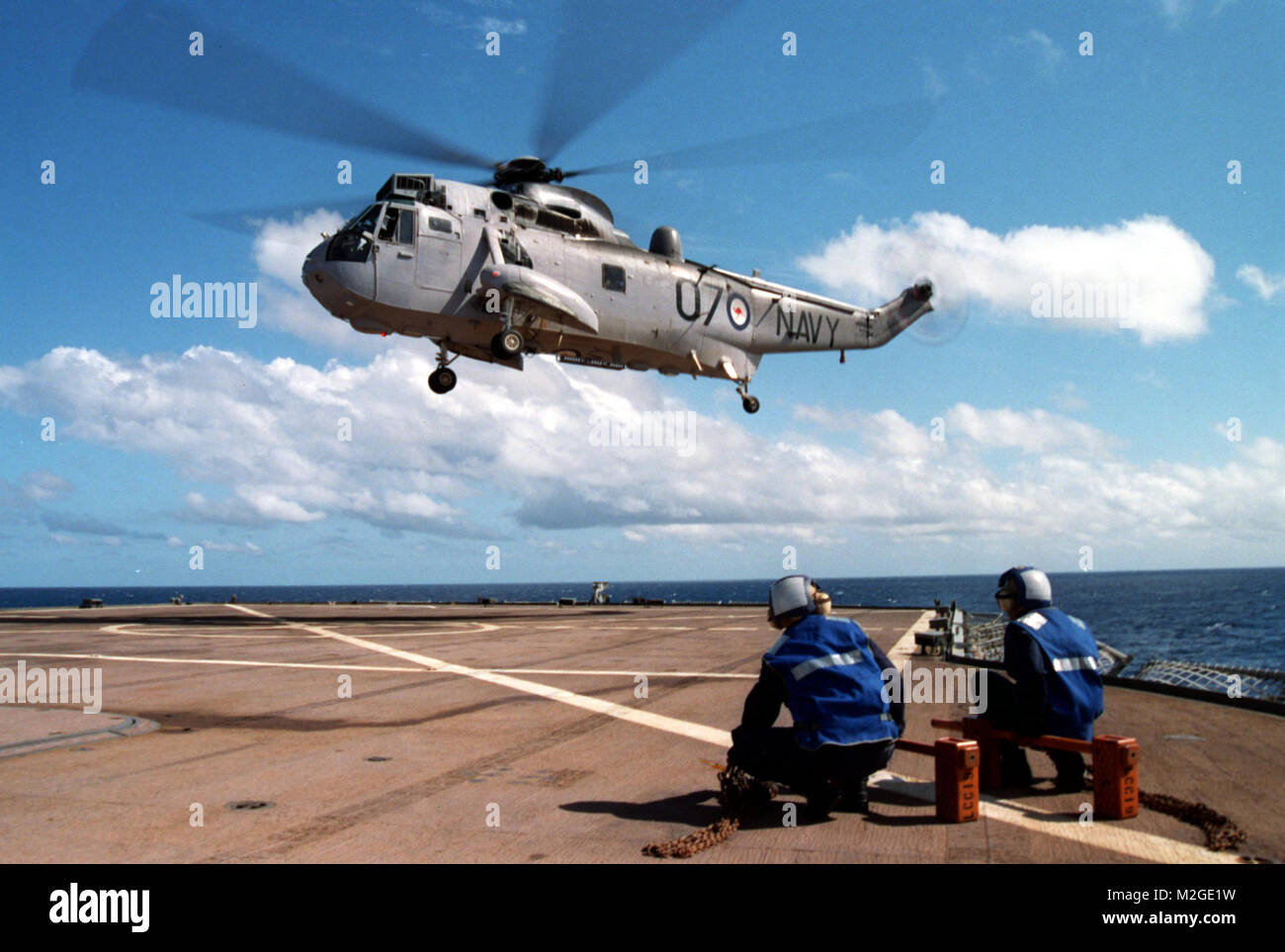 010520-N-2517J-001 Aboard USS Blue Ridge (May 20, 2001)-- An Australian SH-3 Helicopter lifts off the flight deck of USS Blue Ridge (LCC 19), after receiving supplies and fuel.   Blue Ridge is currently participating in exercise Tandem Thrust '01, a combined United States and Australian military training exercise.  This biannual exercise is being held in the vicinity of Shoalwater Bay training area, Queensland, Australia.  More than 27,000 military members are participating.  Canadian units are taking part as opposing forces.  Tandem Thrust is a training exercise for crisis action planning and Stock Photo